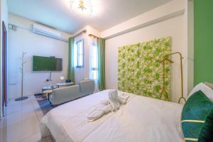Postel nebo postele na pokoji v ubytování 3Kiss Homestay
