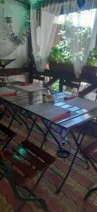 a picnic table with books on it on a floor at Casa David in Sulina
