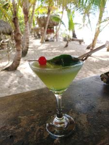 a margarita in a glass on a table at the beach at Puntacana Ecolodge Lavacama Beach Costa Arrecife in Punta Cana
