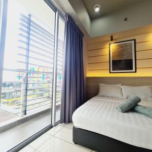 a bedroom with a bed and a large window at Aeropod 2 Queen Bed Near Airport & KK city Free Parking Netflix in Kota Kinabalu