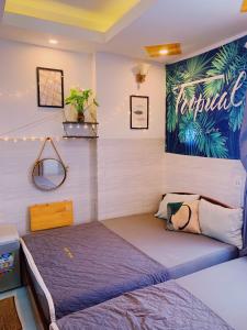 a small bed in a room with at Lighthouse Homestay Vũng Tàu in Vung Tau