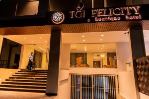 a man on a bike in front of a building at TGI Felicity in Bangalore