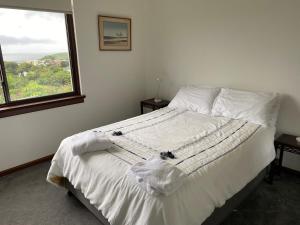 A bed or beds in a room at The Lookout - Coffs Harbour, NSW