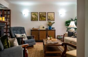 a living room with a couch and chairs and a table at Mountain Sanctuary B&B in Mount Tamborine