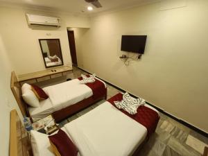 TV a/nebo společenská místnost v ubytování GT Grande Hotel-Near US Consulate