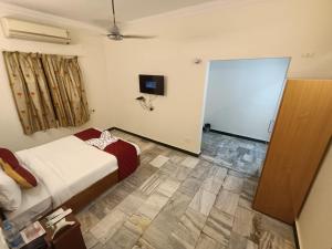 Postel nebo postele na pokoji v ubytování GT Grande Hotel-Near US Consulate