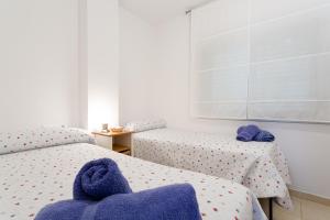 Säng eller sängar i ett rum på Apartament Sant Antoni