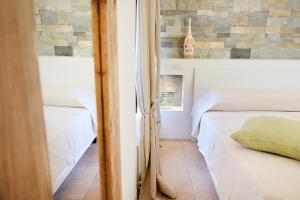 Voodi või voodid majutusasutuse Borgo del Nespolo toas