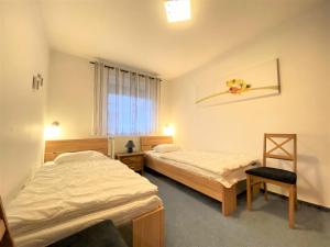 Postel nebo postele na pokoji v ubytování Haus Seebär Whg. 1 Hollwert 29a 70qm