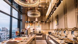 a restaurant with a buffet line with food on display at Kloud Hotel in Taichung