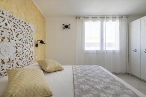 Katil atau katil-katil dalam bilik di Appartamento vista Golfo
