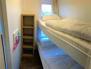 En eller flere senge i et værelse på Greenchalets Frejus Saint Aygulf