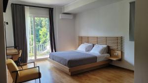 Postel nebo postele na pokoji v ubytování Theoxenia Hotel