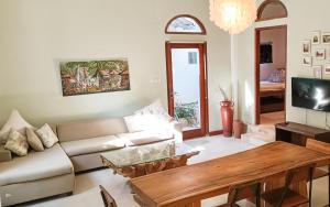 a living room with a couch and a table at Soraya Yoga Wellness Center in Gili Trawangan