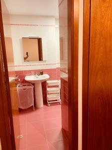 a bathroom with a sink and a mirror at Playa Nigrán in Nigrán