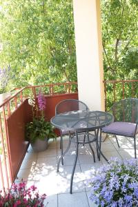 a patio with a table and chairs on a balcony at TS City Centre Apartment in Szczecin