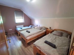 Postel nebo postele na pokoji v ubytování Garden Vendégház Velence