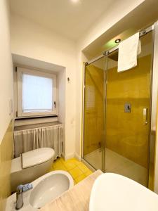 a bathroom with a shower and a toilet and a sink at Luxury Villa Relax in Ischia Town +41 photos
