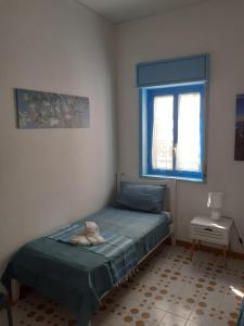 Postel nebo postele na pokoji v ubytování Mondello apartment Casa colori