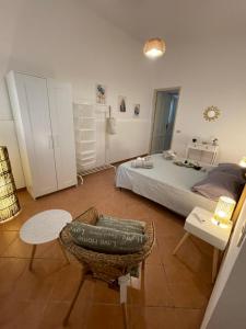A bed or beds in a room at Casa vacanze Baglio Barcellona Mondello