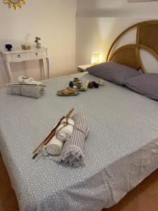 A bed or beds in a room at Casa vacanze Baglio Barcellona Mondello