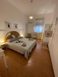 A bed or beds in a room at Casa vacanze Baglio Barcellona Mondello