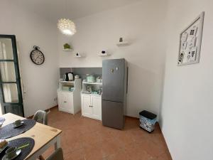 A kitchen or kitchenette at Casa vacanze Baglio Barcellona Mondello
