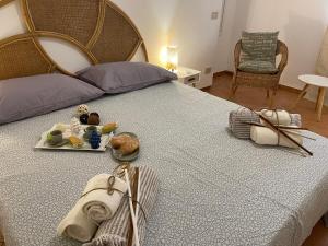 A bed or beds in a room at Casa vacanze Baglio Barcellona Mondello