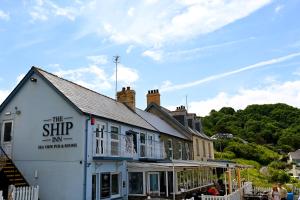 a building with a sign that reads the ship inn at Ship Inn in Aberporth