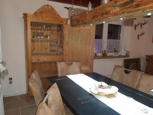 a dining room with a blue table and chairs at Jägerhaus in Nossen