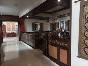 a hallway of a home with a staircase and a room at Aster Residence in Chiang Mai +8 photos