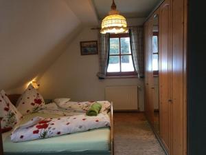 A bed or beds in a room at Bio-Bauernhof Anawander
