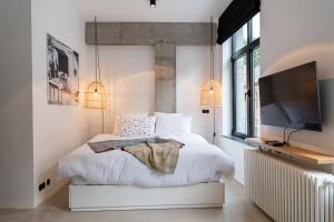 Ein Bett oder Betten in einem Zimmer der Unterkunft Espace 43 - Les 7 chambres
