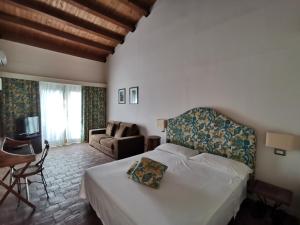 Ένα ή περισσότερα κρεβάτια σε δωμάτιο στο La Masseria - Rainbow Hotel LGBT - Adults Only