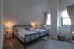 Postel nebo postele na pokoji v ubytování Buitenplaats 37 Callantsoog