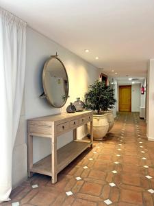 a dressing table with a mirror on a hallway at Soho Boutique Atalia in Córdoba