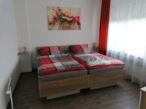 Postel nebo postele na pokoji v ubytování Ferienwohnung in der Marktstraße