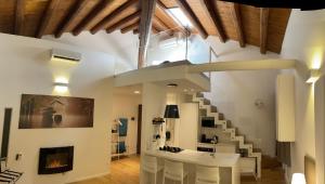 a living room with a staircase and a fireplace at meloluxuryhouse in Palermo