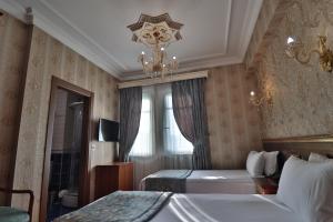 a bedroom with a large bed and a large window at Blue House Hotel in Istanbul