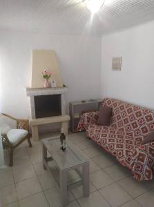 a living room with a bed and a fireplace at Eutyxia House in Gaios Walk to Center & Beaches in Gaios