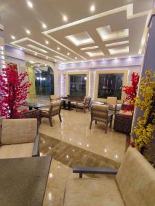 a lobby with chairs and tables in a building at La Boutique Residence in Hurghada