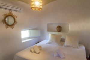 En eller flere senge i et værelse på Casa Muro Luxury Villa