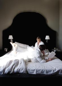 Кровать или кровати в номере Clarion Hotel Post