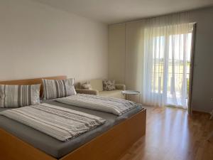 Katil atau katil-katil dalam bilik di Holiday apartment in St Kanzian on Lake Klopein