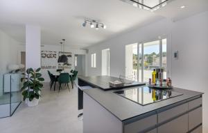 A kitchen or kitchenette at Modern Villa with Spacious Outdoor near Beach and Amenities