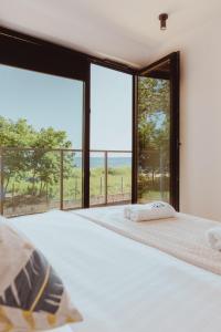 Posteľ alebo postele v izbe v ubytovaní Nalu Beach - luksusowe domki na plaży