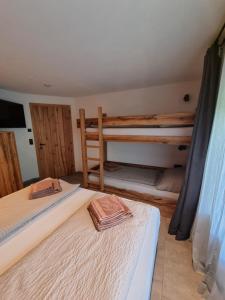 Voodi või voodid majutusasutuse Kaiser Traum Appartement - Wildschönau PREMIUM Card in Summer toas