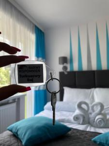 Posteľ alebo postele v izbe v ubytovaní Willa Barwy Wspomnień
