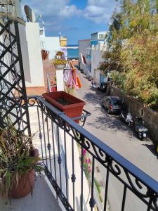 a balcony with a view of a parking lot at Visitponza - Vesta in Ponza