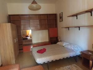 a small room with a bed in a room at Milhouse in Cagliari